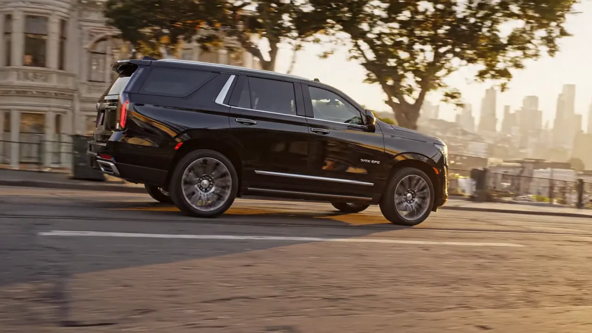Black luxury vehicle traveling through San Francisco